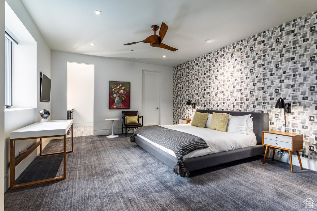 Carpeted bedroom featuring recessed lighting and a ceiling fan