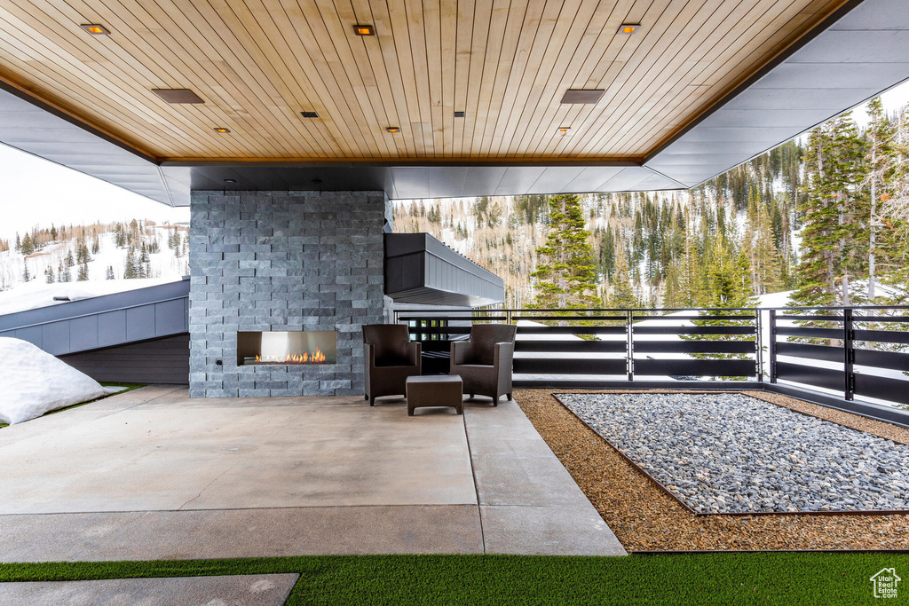 View of patio / terrace with an outdoor brick fireplace