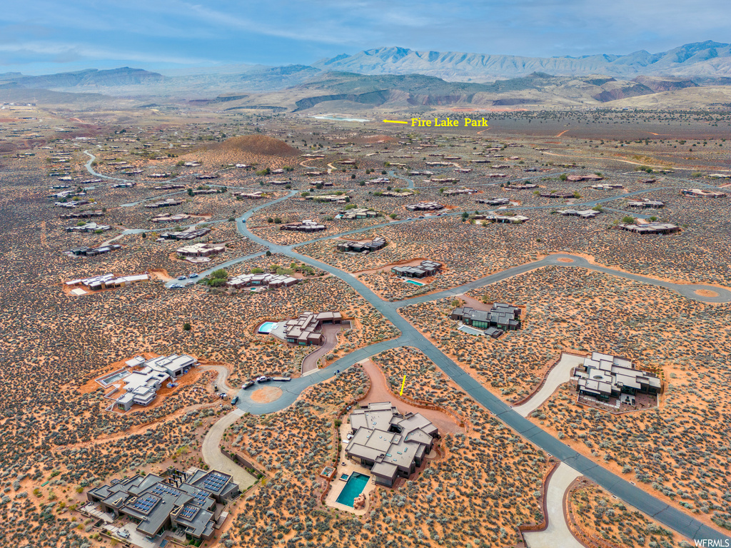 Birds eye view of property with a mountain view