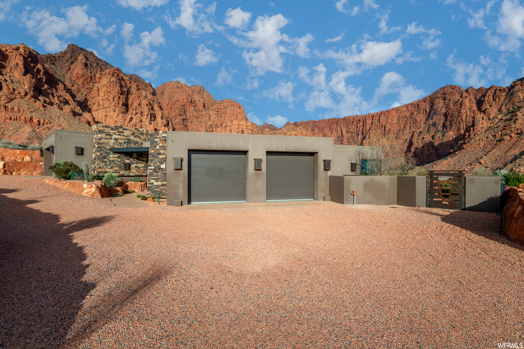 View of front of house featuring a garage and a mountain view