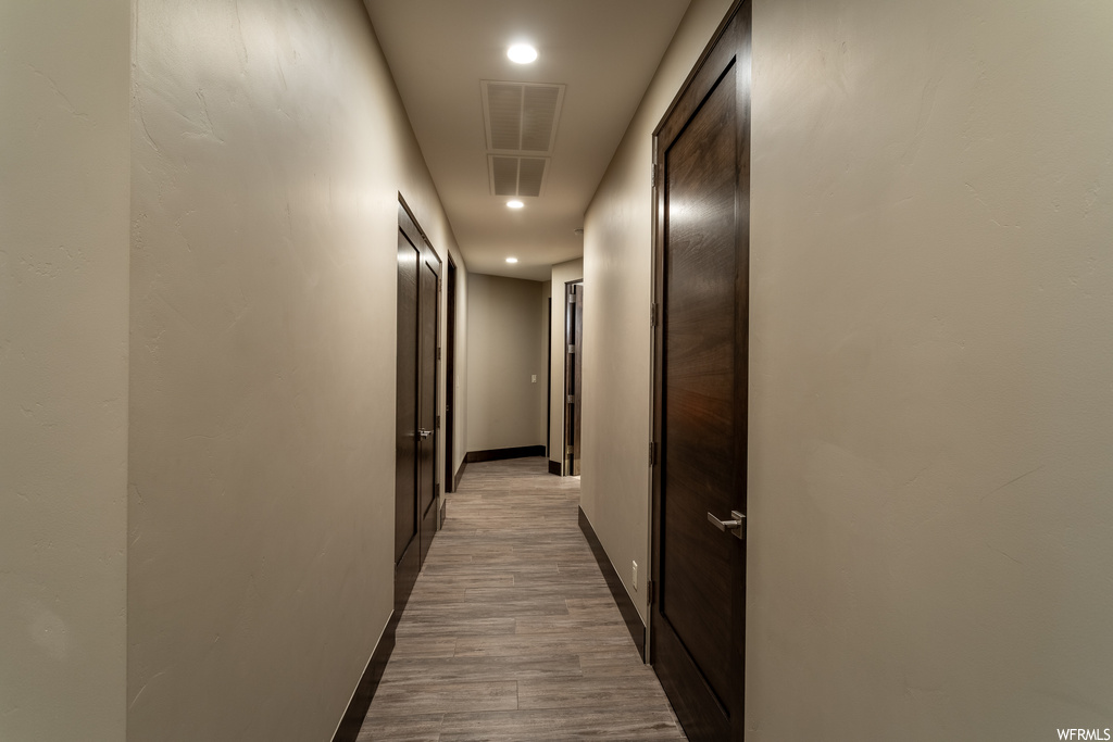 Corridor featuring hardwood / wood-style floors