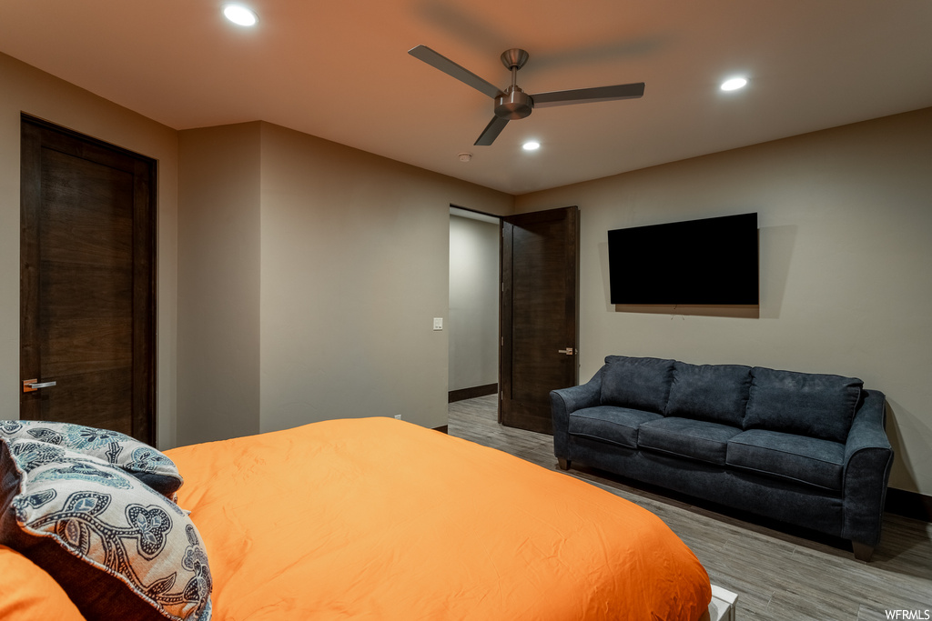 Bedroom featuring hardwood / wood-style flooring and ceiling fan