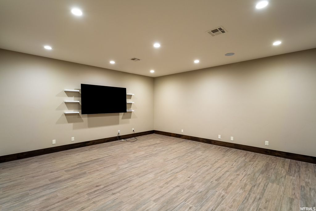 Unfurnished room with light hardwood / wood-style flooring