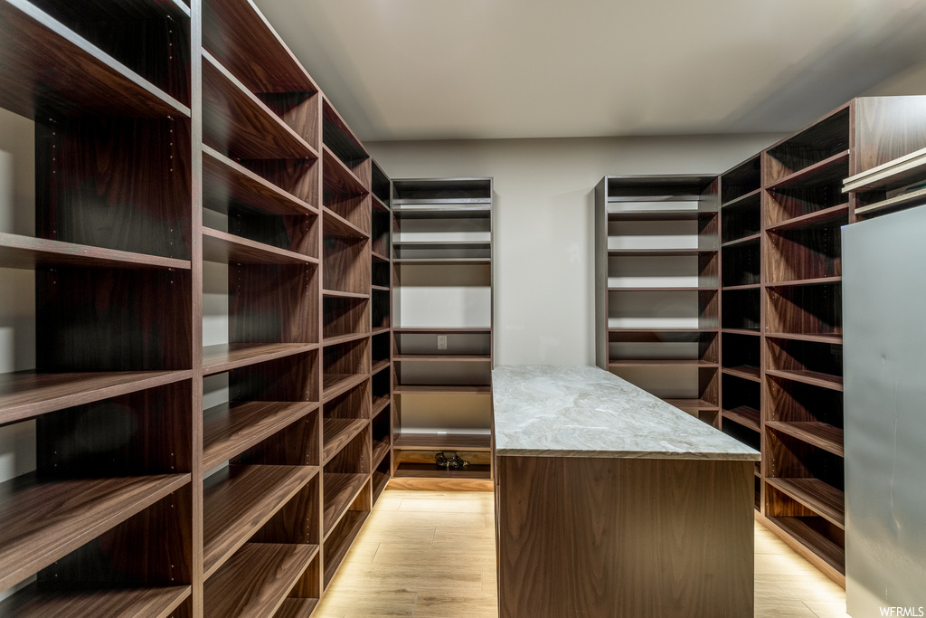 Walk in closet featuring light hardwood / wood-style floors