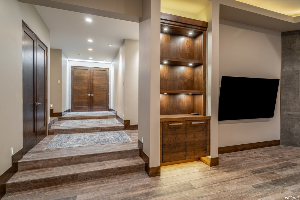 Hallway featuring light hardwood / wood-style flooring