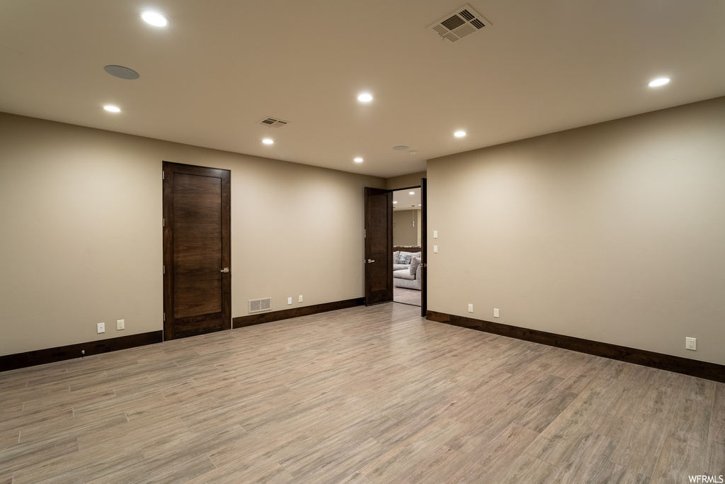 Spare room with light hardwood / wood-style floors