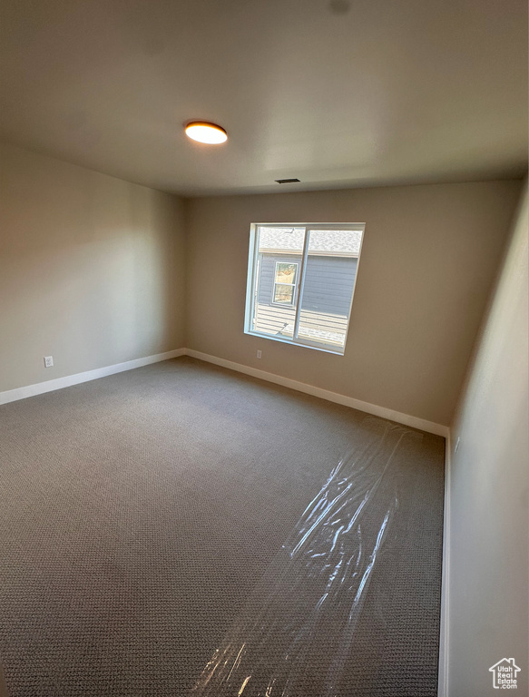 View of carpeted spare room