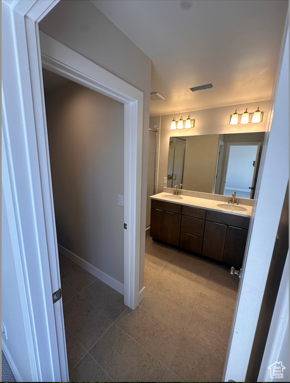 Bathroom with a shower and vanity