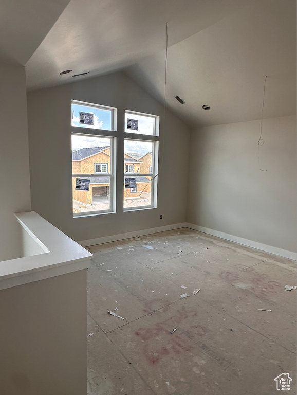 Additional living space featuring vaulted ceiling