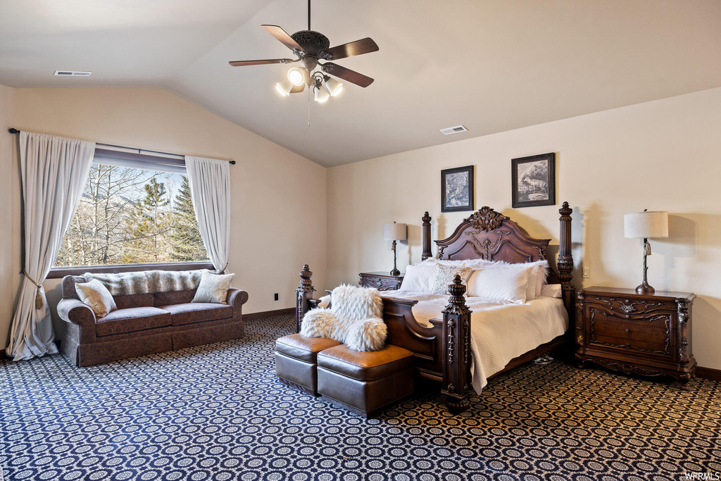 Bedroom featuring vaulted ceiling and ceiling fan