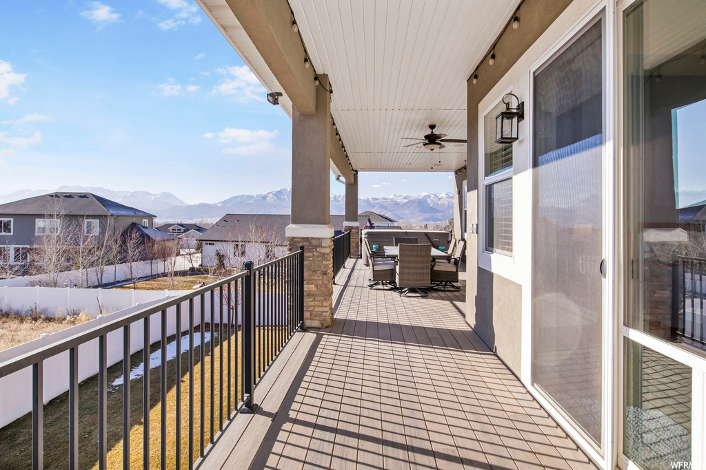 Balcony with ceiling fan and a mountain view