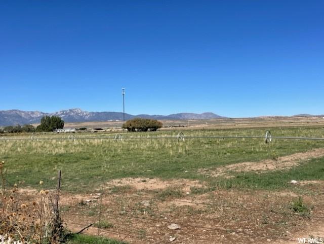 Property view of mountains with a rural view