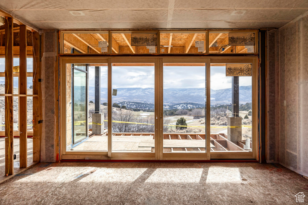 Interior space with a wealth of natural light and a mountain view
