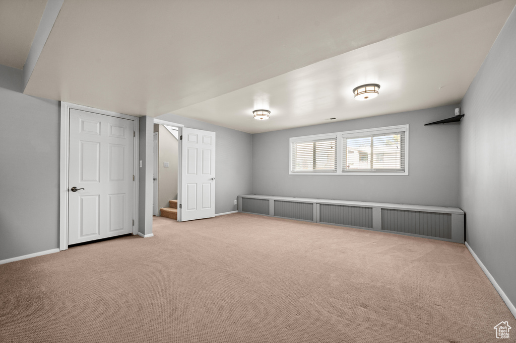 Spare room with light colored carpet