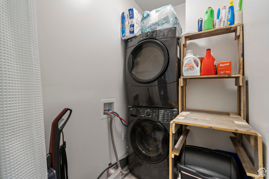 Clothes washing area with washer hookup and stacked washer and clothes dryer