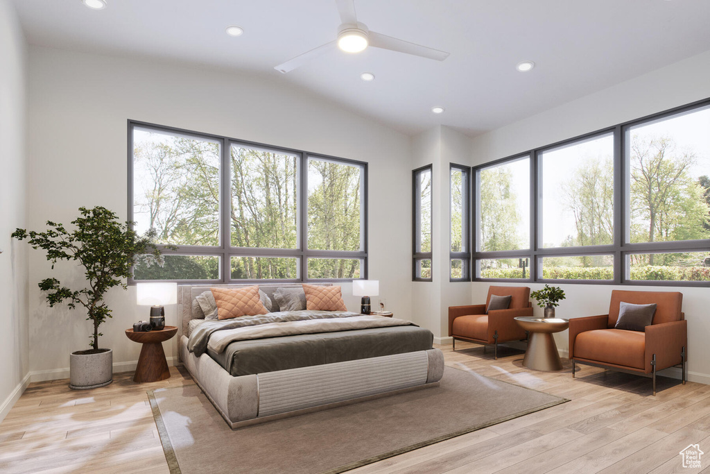 Bedroom with light hardwood / wood-style flooring, multiple windows, and ceiling fan