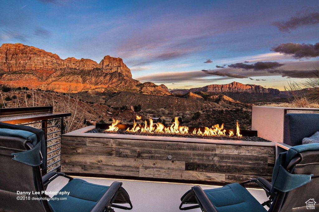 Exterior space with a fire pit and a mountain view