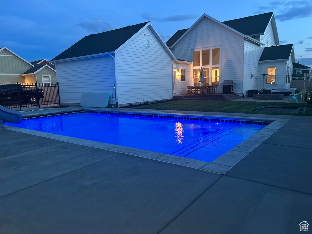 View of pool at dusk