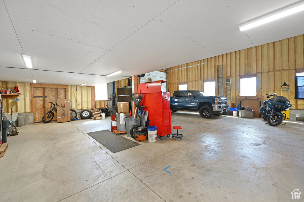 Garage featuring wood walls