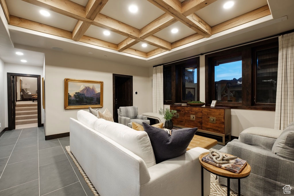 Cinema room featuring beam ceiling, tile patterned floors, and coffered ceiling