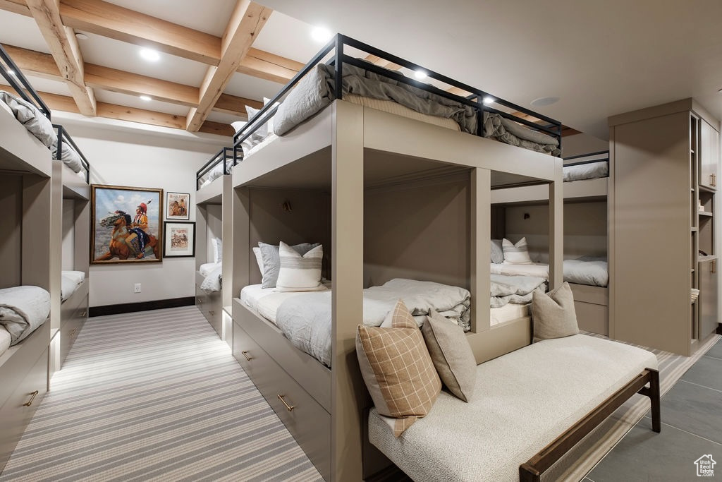Bedroom featuring beamed ceiling and coffered ceiling