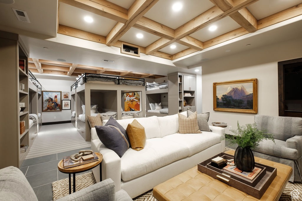 Living room featuring tile patterned flooring, beamed ceiling, built in shelves, and coffered ceiling