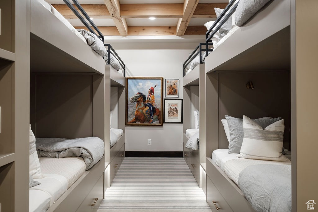 Bedroom with beamed ceiling and coffered ceiling