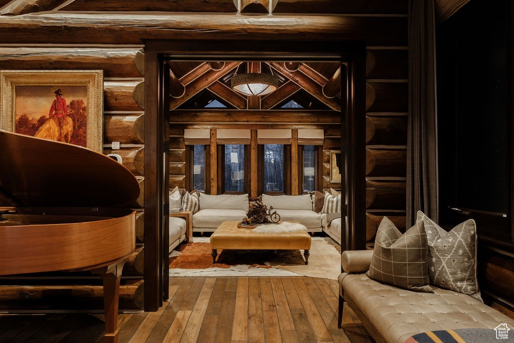 Sitting room featuring beam ceiling and hardwood / wood-style floors