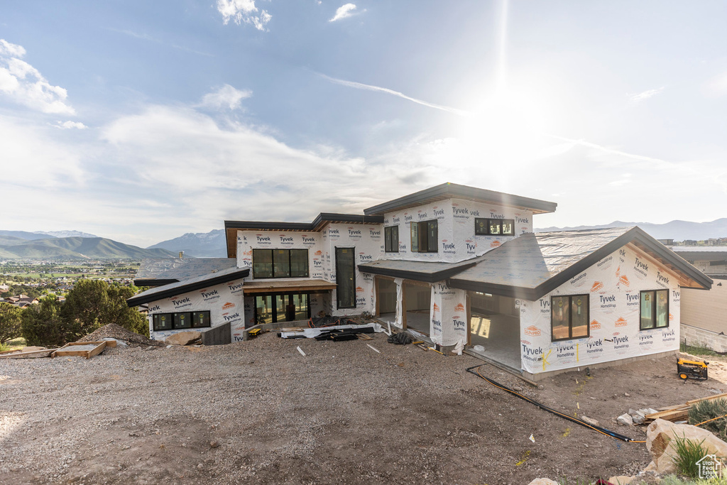 Unfinished property featuring a mountain view