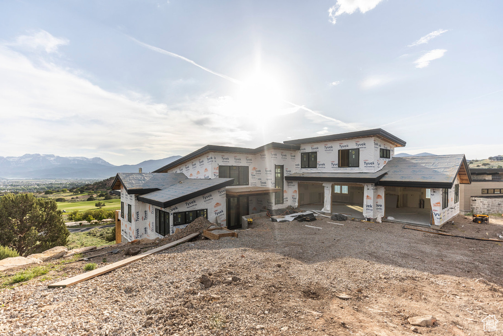 Rear view of house with a mountain view