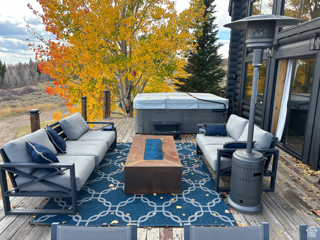View of patio / terrace featuring an outdoor living space and a deck