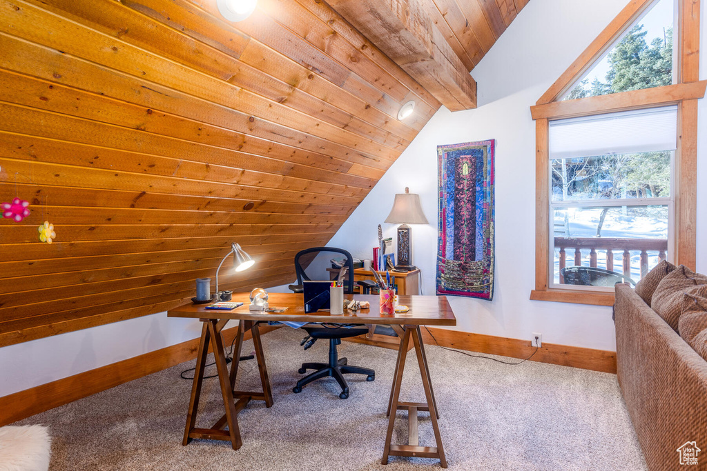 Carpeted home office with lofted ceiling and wood ceiling