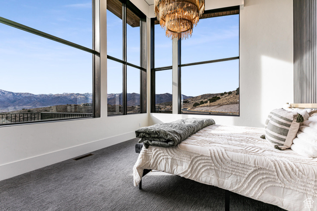 Carpeted bedroom featuring a mountain view