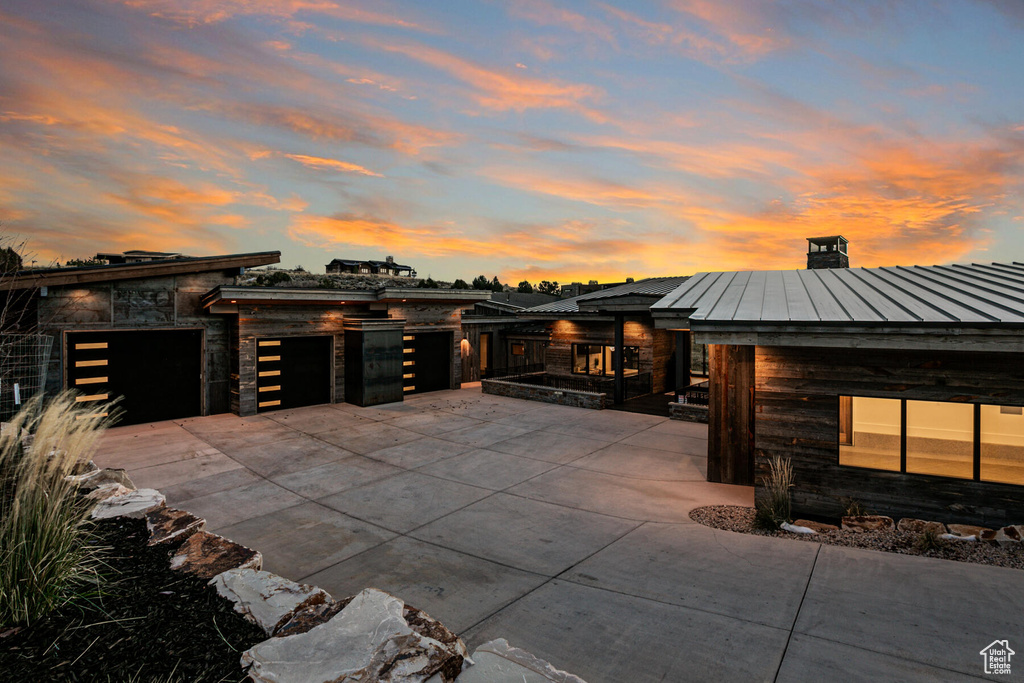 Patio terrace at dusk with area for grilling