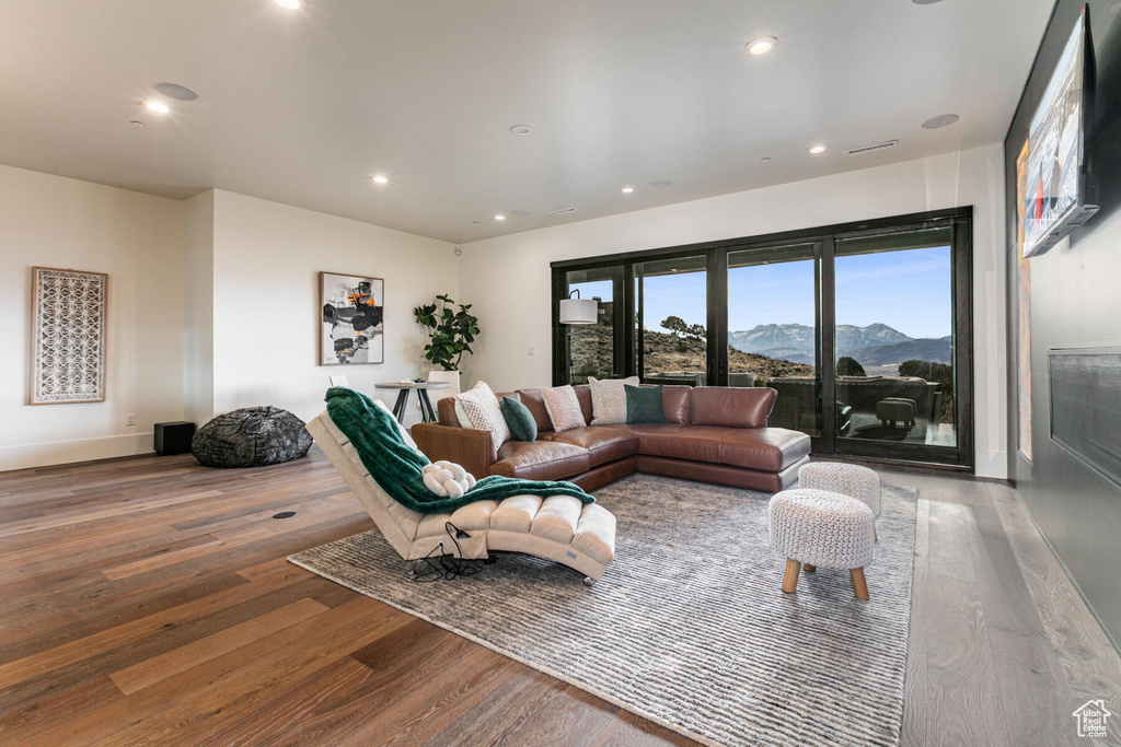 Living room with a mountain view and light hardwood / wood-style floors