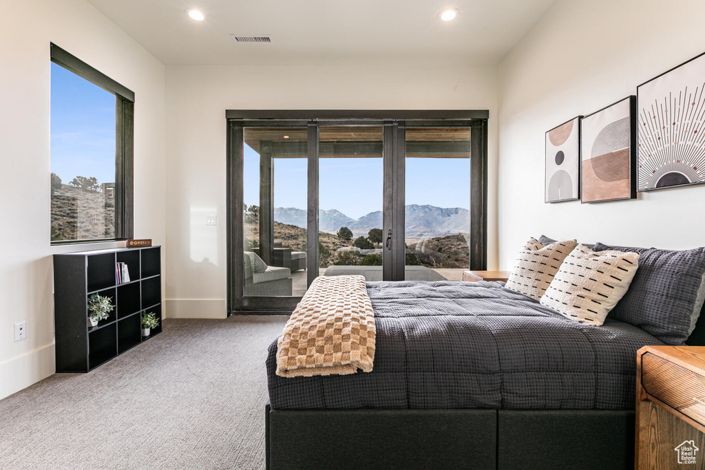 Carpeted bedroom featuring a mountain view