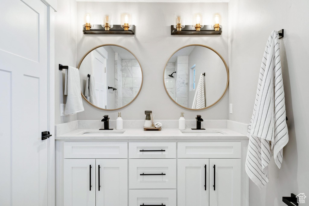 Bathroom featuring dual sinks and oversized vanity
