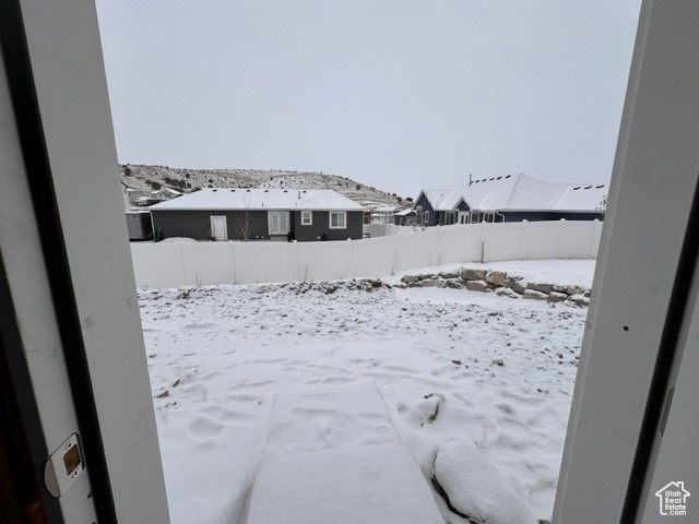View of yard layered in snow