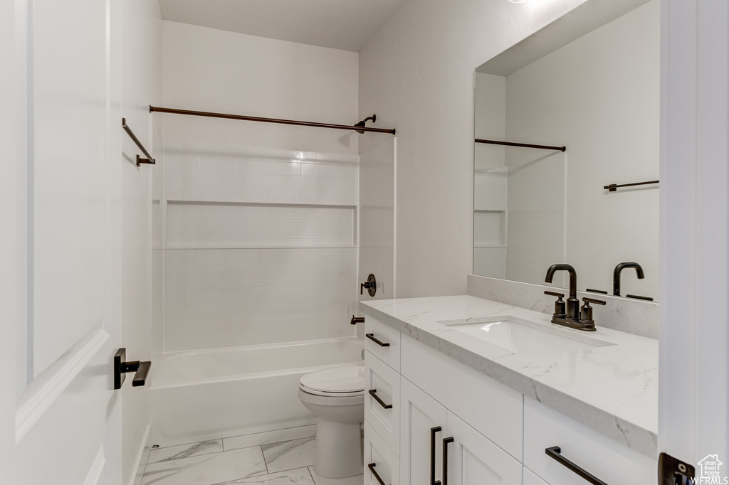 Full bathroom featuring vanity, toilet, shower / bath combination, and tile flooring