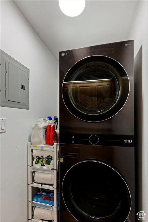 Laundry room featuring stacked washer and clothes dryer