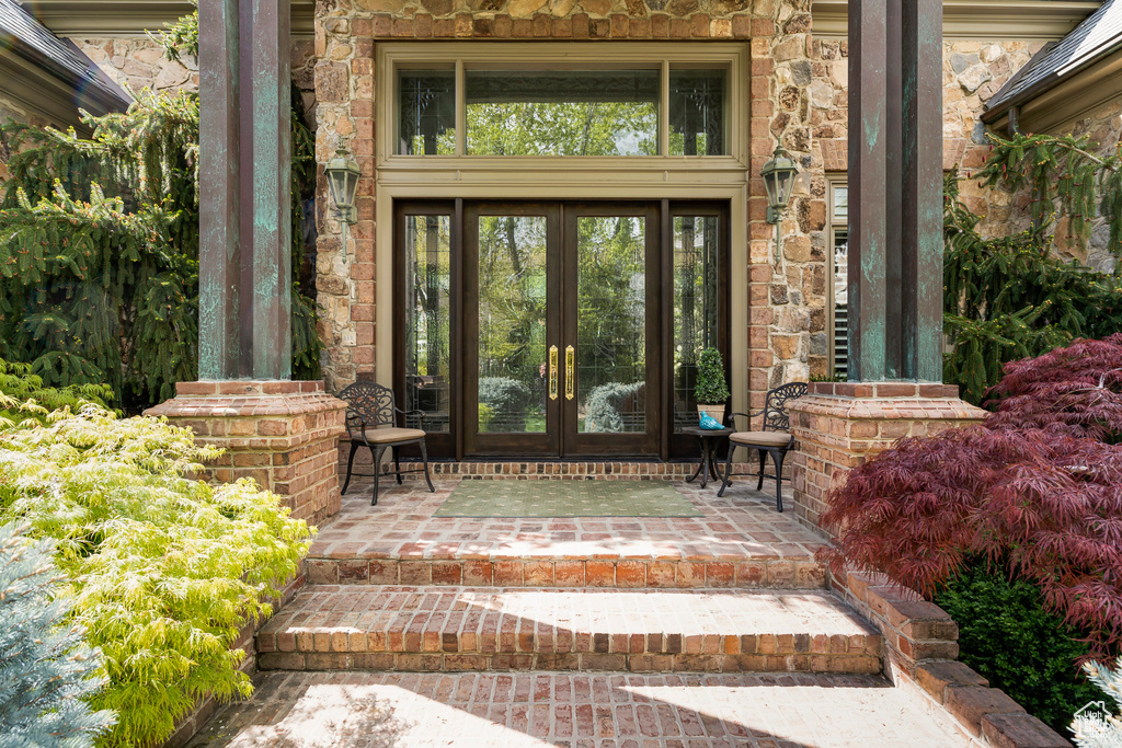 Property entrance featuring french doors