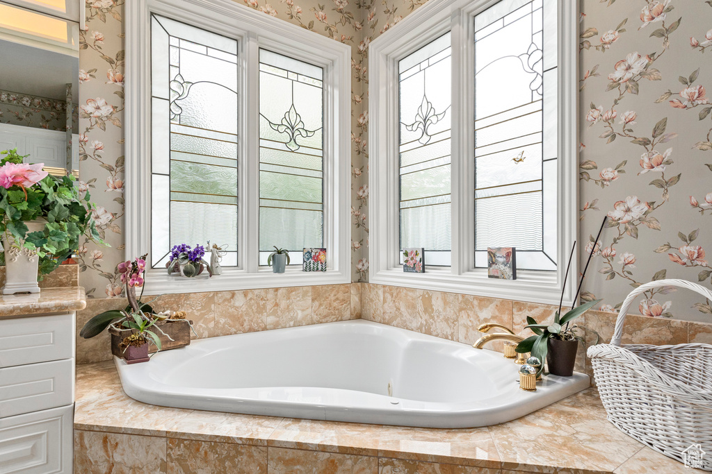 Bathroom featuring tiled tub