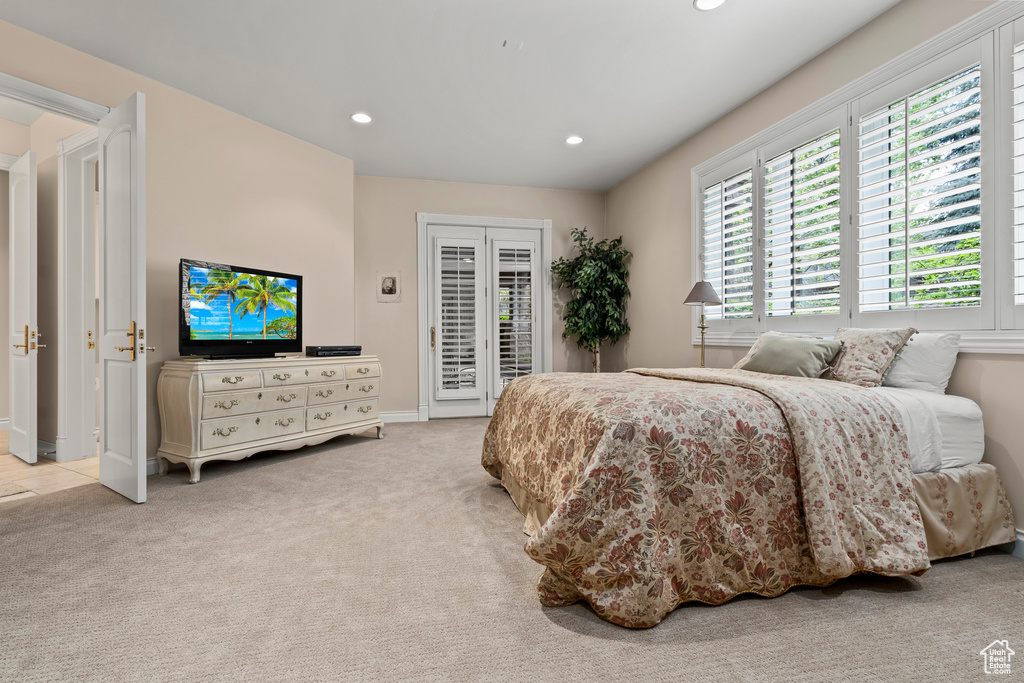 Carpeted bedroom with access to exterior