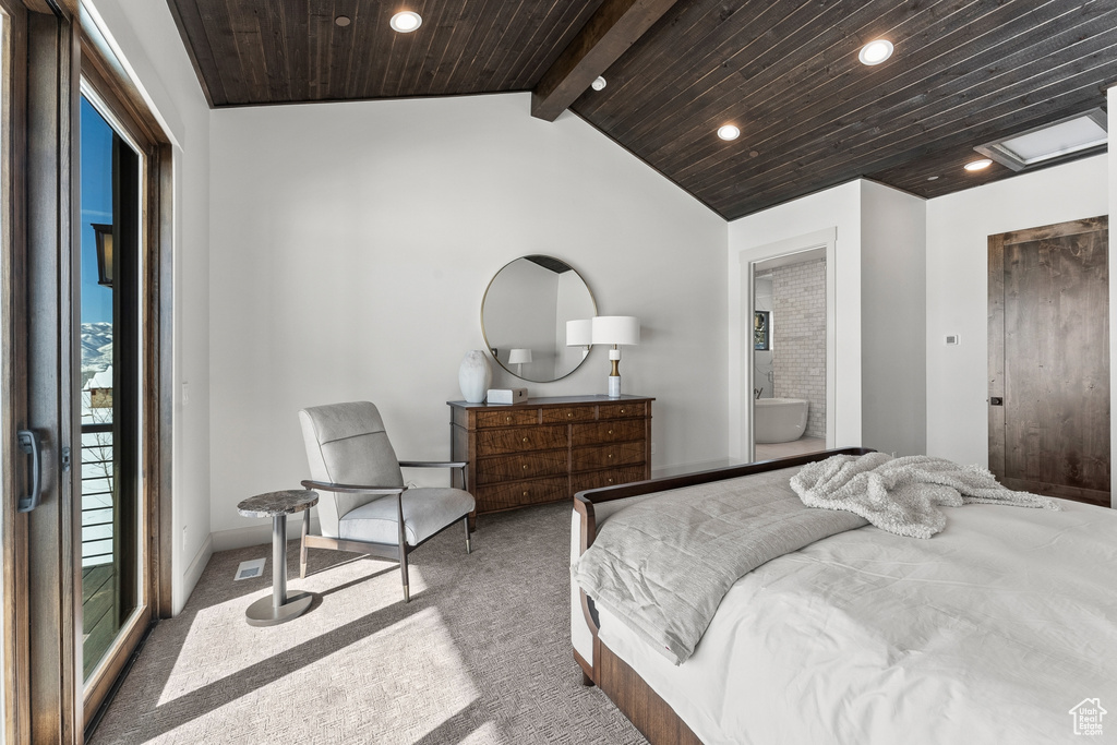Bedroom featuring multiple windows, wooden ceiling, dark colored carpet, and access to exterior