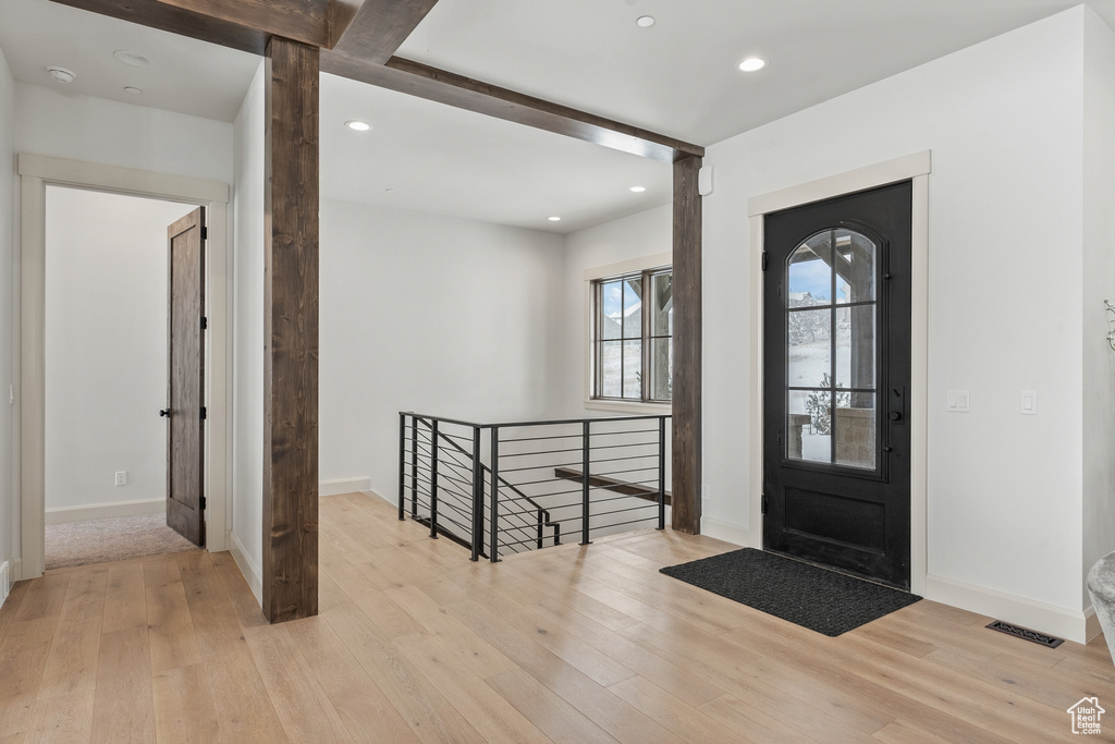 Entrance foyer featuring light hardwood / wood-style floors