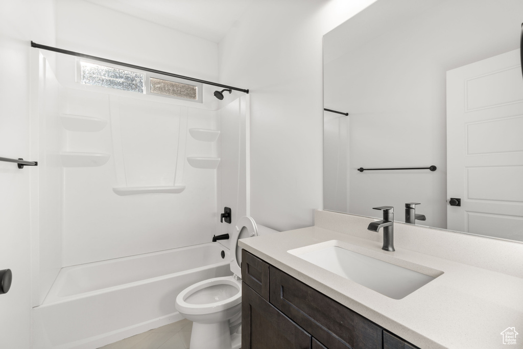 Full bathroom featuring tile floors, toilet, shower / bathing tub combination, and large vanity