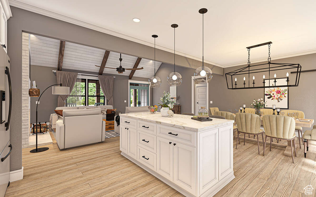 Kitchen with light stone countertops, ceiling fan with notable chandelier, hanging light fixtures, light hardwood / wood-style flooring, and white cabinets