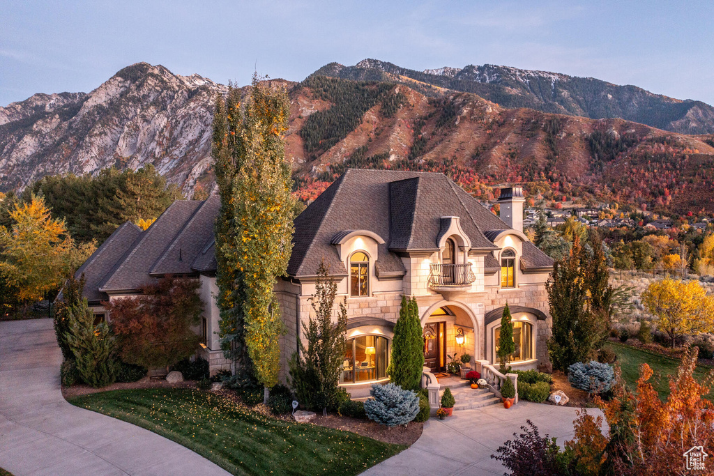 French country home featuring a mountain view and a balcony
