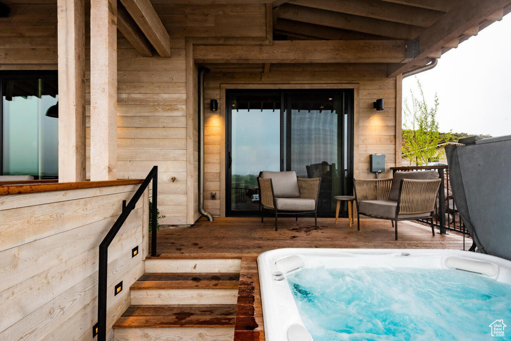 Exterior space with an outdoor hot tub