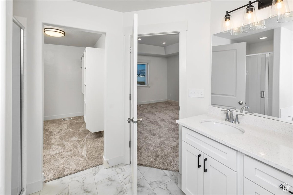 Bathroom featuring tile floors and oversized vanity